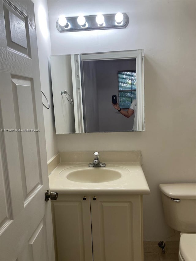 5450 NW 107th Ave Unit 705, Doral, FL 33178 - bathroom with vanity and toilet
