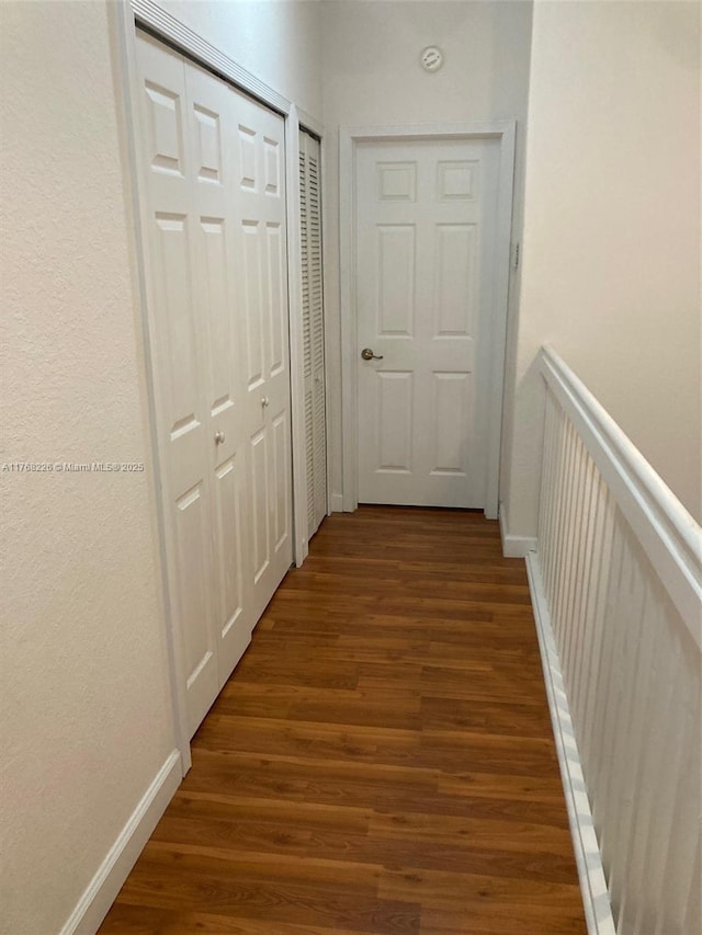5450 NW 107th Ave Unit 705, Doral, FL 33178 - hall featuring baseboards and wood finished floors