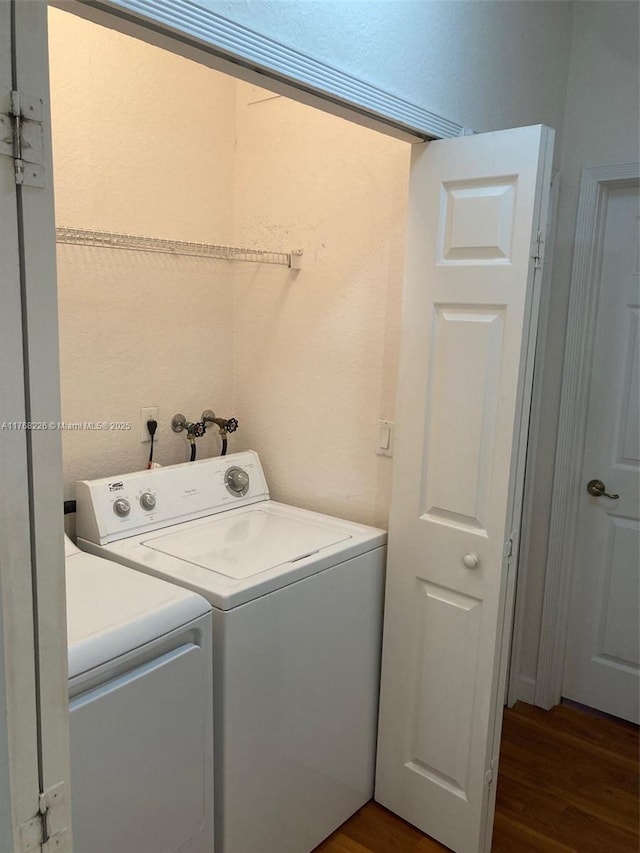 5450 NW 107th Ave Unit 705, Doral, FL 33178 - laundry room featuring laundry area, wood finished floors, and washer and clothes dryer