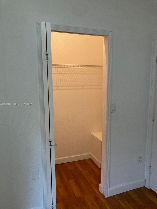 5450 NW 107th Ave Unit 705, Doral, FL 33178 - walk in closet with wood finished floors