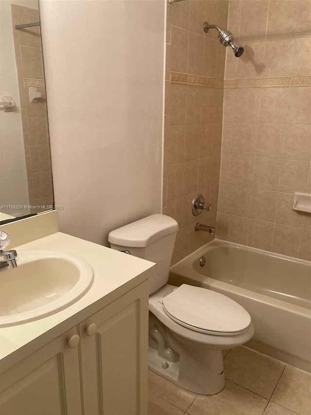 5450 NW 107th Ave Unit 705, Doral, FL 33178 - bathroom featuring tile patterned floors, toilet, vanity, and  shower combination