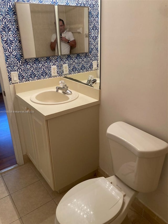 5450 NW 107th Ave Unit 705, Doral, FL 33178 - half bathroom with toilet, vanity, and tile patterned flooring