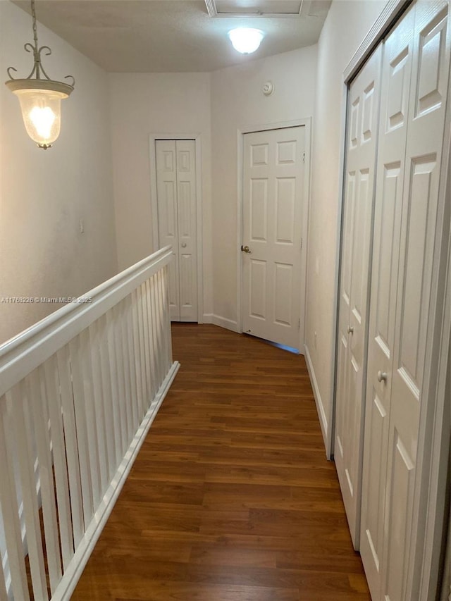 5450 NW 107th Ave Unit 705, Doral, FL 33178 - hall featuring dark wood-type flooring, attic access, and baseboards