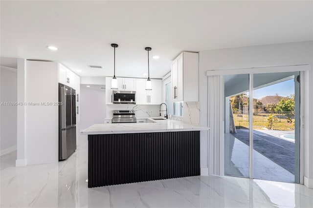 1801 Hancock Bridge Pkwy, Cape Coral, FL 33990 - kitchen featuring light stone countertops, appliances with stainless steel finishes, a peninsula, marble finish floor, and a sink