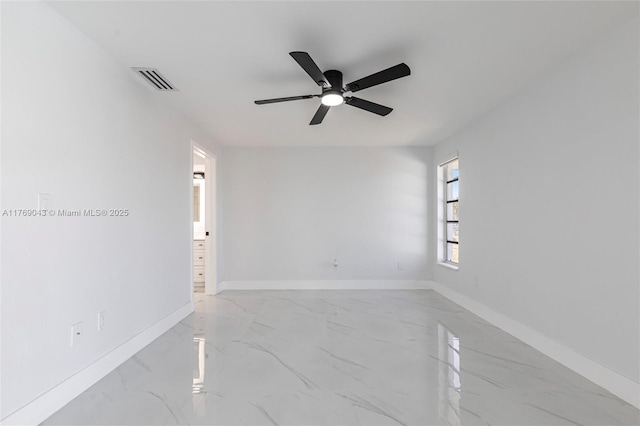 1801 Hancock Bridge Pkwy, Cape Coral, FL 33990 - empty room featuring visible vents, marble finish floor, baseboards, and a ceiling fan