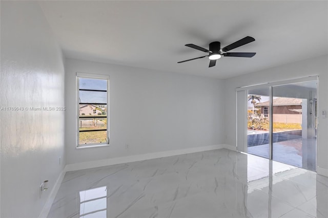 1801 Hancock Bridge Pkwy, Cape Coral, FL 33990 - spare room with marble finish floor, baseboards, and ceiling fan
