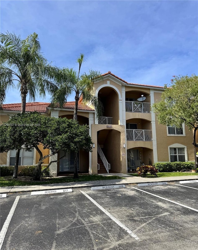 5530 NW 61st St Unit 303, Coconut Creek, FL 33073 - view of property with uncovered parking