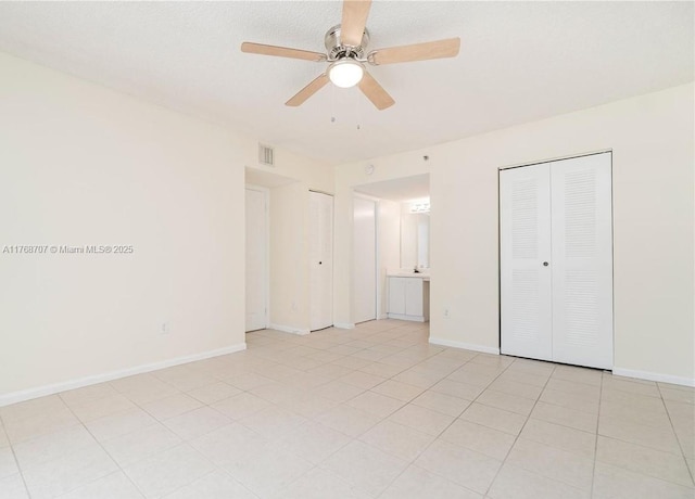 5530 NW 61st St Unit 303, Coconut Creek, FL 33073 - unfurnished bedroom with baseboards and ceiling fan