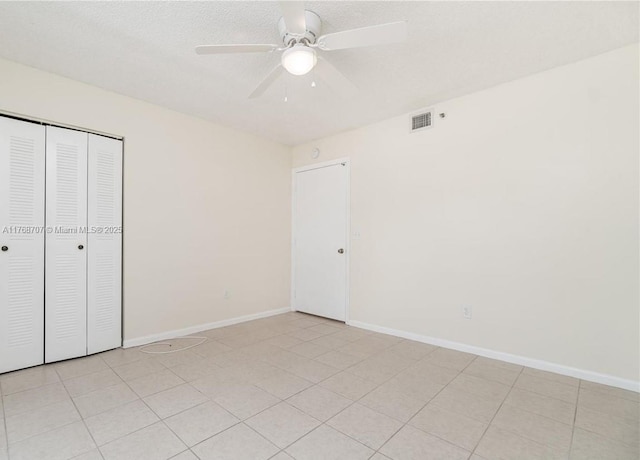 5530 NW 61st St Unit 303, Coconut Creek, FL 33073 - unfurnished bedroom featuring a closet and ceiling fan