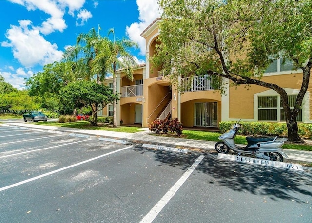 5530 NW 61st St Unit 303, Coconut Creek, FL 33073 - view of property with uncovered parking