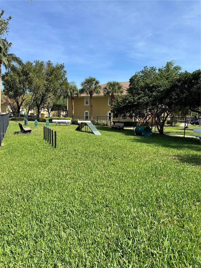 5530 NW 61st St Unit 303, Coconut Creek, FL 33073 - view of yard featuring a dog friendly area