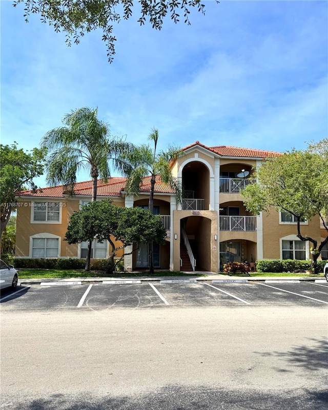 5530 NW 61st St Unit 303, Coconut Creek, FL 33073 - view of property with uncovered parking