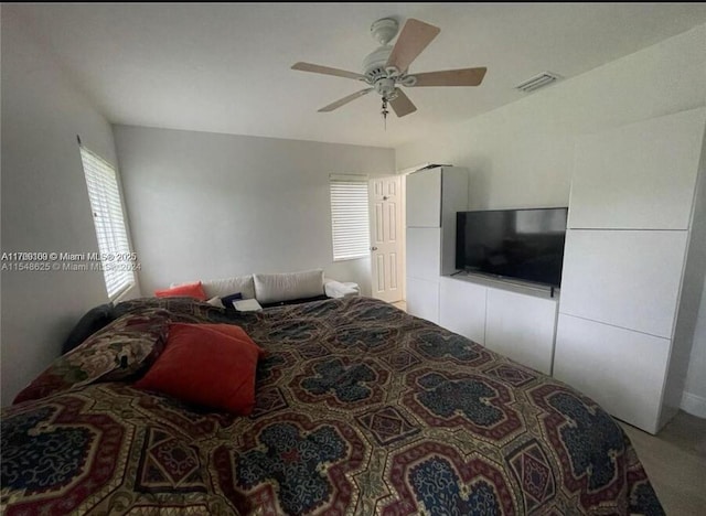 bedroom featuring ceiling fan and visible vents