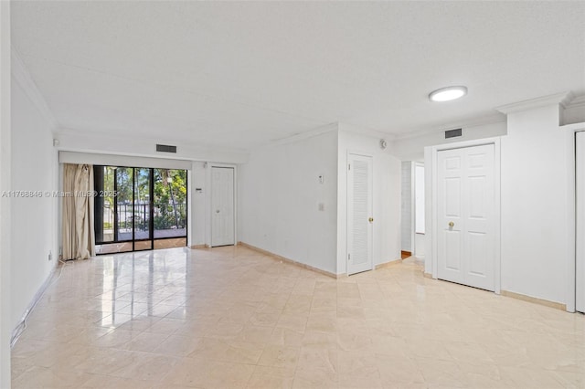 77 Crandon Blvd Unit 2B, Key Biscayne, FL 33149 - empty room with crown molding and baseboards
