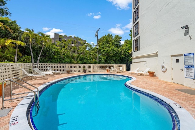 77 Crandon Blvd Unit 2B, Key Biscayne, FL 33149 - community pool featuring a patio area