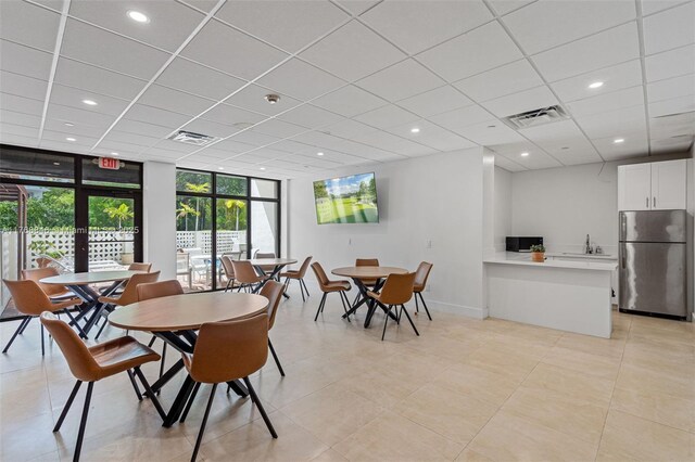 77 Crandon Blvd Unit 2B, Key Biscayne, FL 33149 - dining area with light tile patterned floors, recessed lighting, a paneled ceiling, and expansive windows