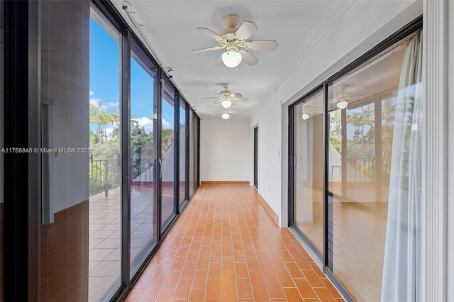 77 Crandon Blvd Unit 2B, Key Biscayne, FL 33149 - unfurnished sunroom featuring crown molding and baseboards