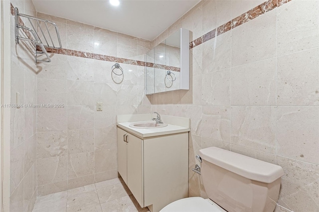 77 Crandon Blvd Unit 2B, Key Biscayne, FL 33149 - bathroom featuring tile walls and vanity