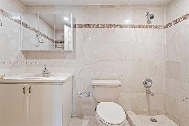 77 Crandon Blvd Unit 2B, Key Biscayne, FL 33149 - bathroom with tile walls, tiled shower, and vanity