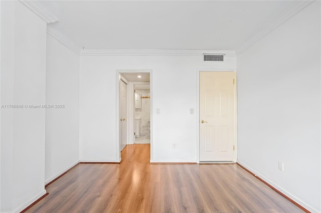 77 Crandon Blvd Unit 2B, Key Biscayne, FL 33149 - empty room with ornamental molding and wood finished floors
