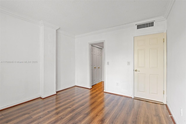 77 Crandon Blvd Unit 2B, Key Biscayne, FL 33149 - spare room featuring wood finished floors and crown molding