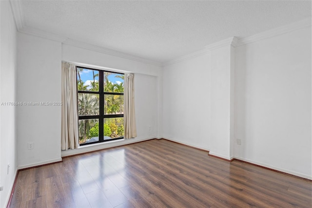77 Crandon Blvd Unit 2B, Key Biscayne, FL 33149 - spare room with wood finished floors, ornamental molding, and a textured ceiling