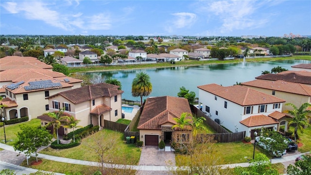 aerial view featuring a water view and a residential view