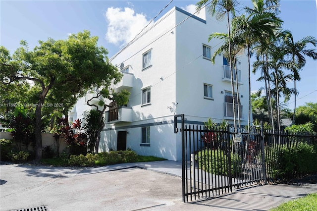 view of building exterior featuring a fenced front yard