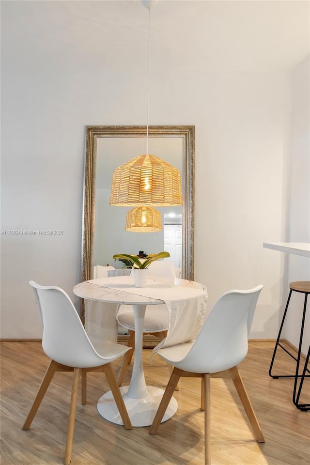 2899 Collins Ave Unit 1638, Miami Beach, FL 33140 - dining room featuring light wood-style flooring