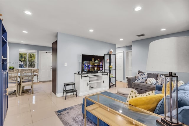 living room with baseboards, visible vents, recessed lighting, and light tile patterned floors