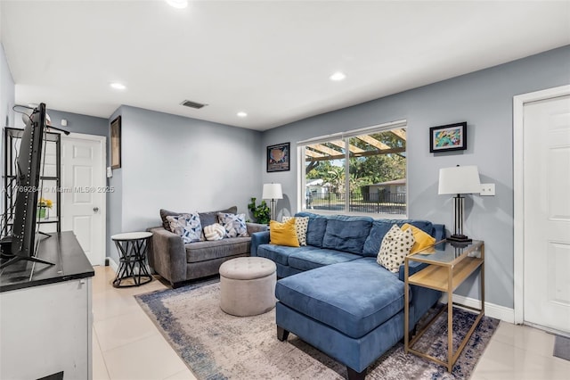 tiled living room with baseboards, visible vents, and recessed lighting