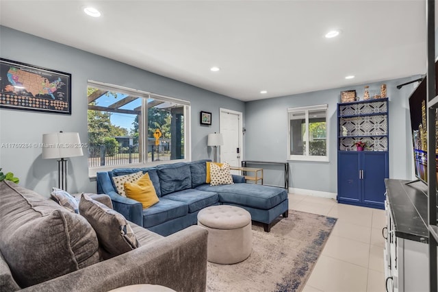 living room with light tile patterned flooring, baseboards, and recessed lighting