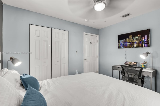 bedroom with a closet, ceiling fan, and visible vents