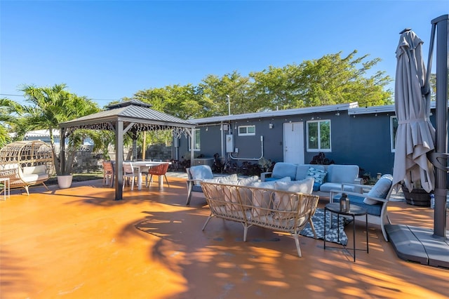 view of patio with outdoor lounge area, outdoor dining area, a gazebo, and fence
