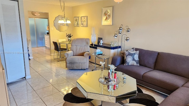 living area featuring an inviting chandelier and light tile patterned floors