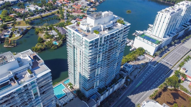birds eye view of property with a water view