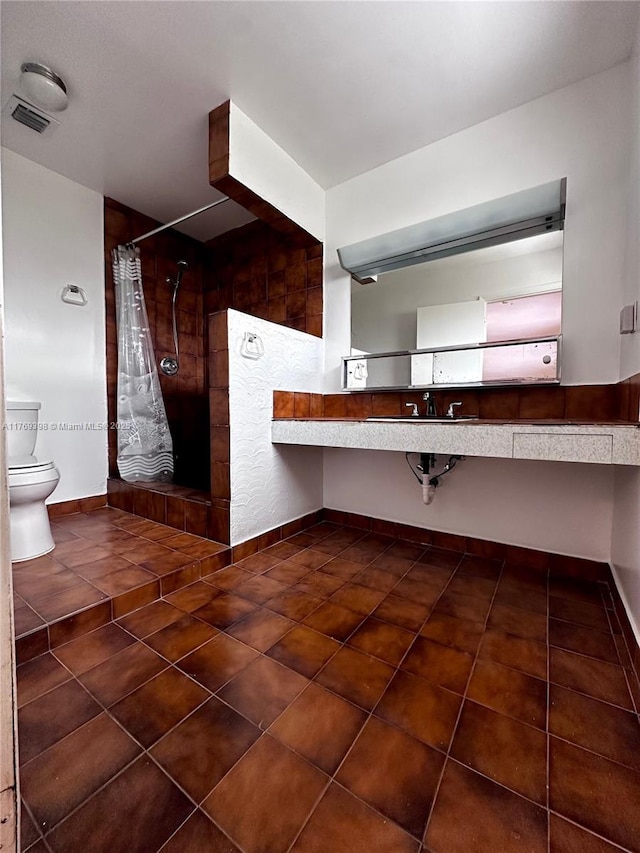 10475 SW 96th Ter, Kendall, FL 33176 - kitchen featuring baseboards, tile patterned floors, and visible vents