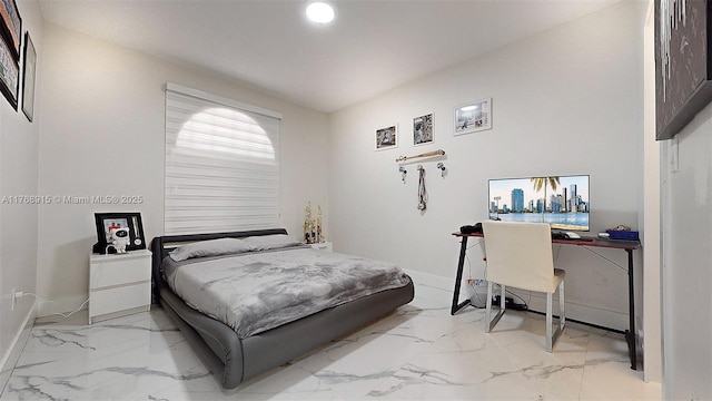 bedroom with baseboards and marble finish floor