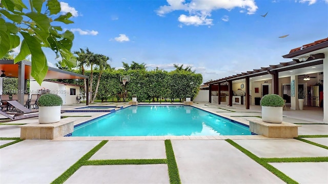 view of swimming pool featuring a fenced in pool, an in ground hot tub, and a patio