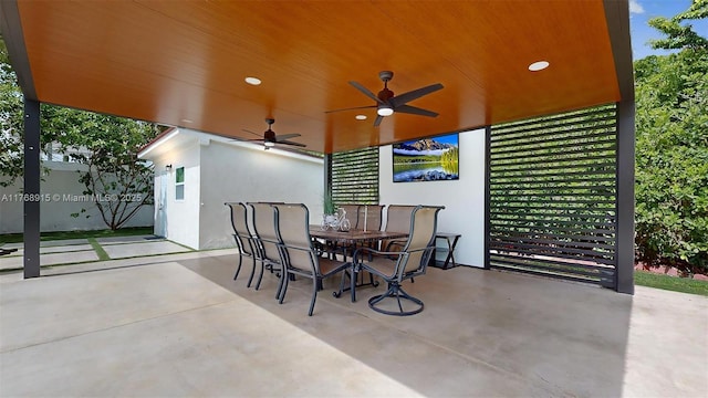 view of patio with ceiling fan and outdoor dining space