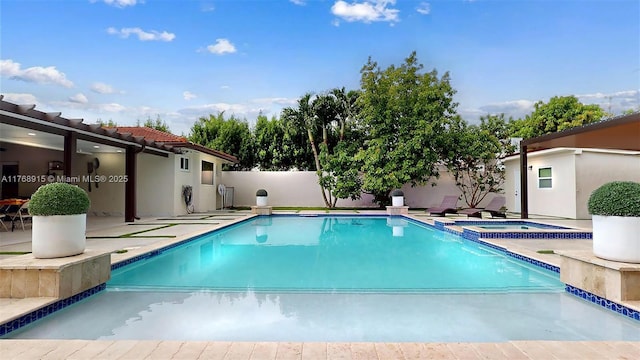view of pool with fence, an in ground hot tub, a patio, and a fenced in pool