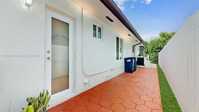 view of patio / terrace featuring fence