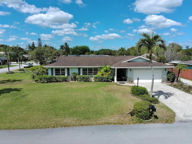 2525 SW 86th Ave, Davie, FL 33324 - ranch-style house with decorative driveway, a front lawn, and an attached garage