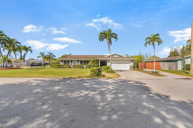 2525 SW 86th Ave, Davie, FL 33324 - single story home with driveway, a front lawn, fence, and an attached garage