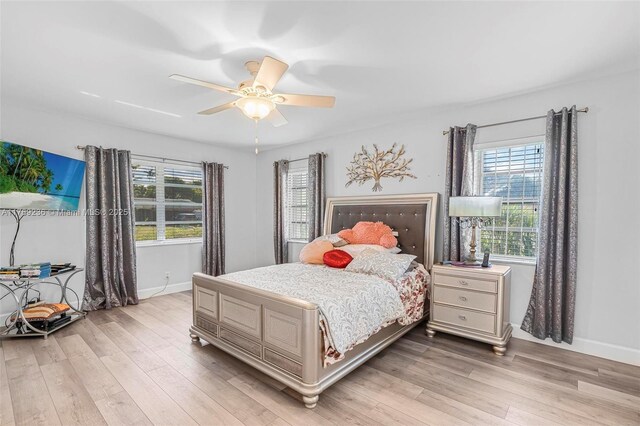 2525 SW 86th Ave, Davie, FL 33324 - bedroom featuring baseboards, light wood-style floors, and a ceiling fan