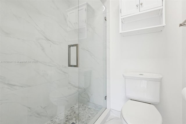 full bathroom featuring marble finish floor, toilet, and a marble finish shower