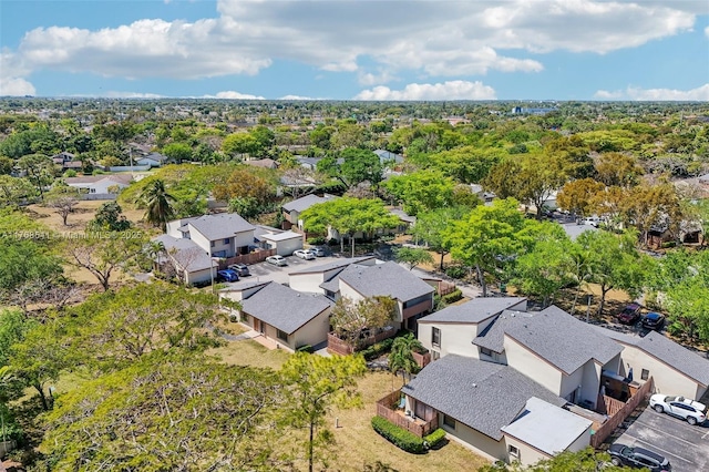 birds eye view of property with a residential view