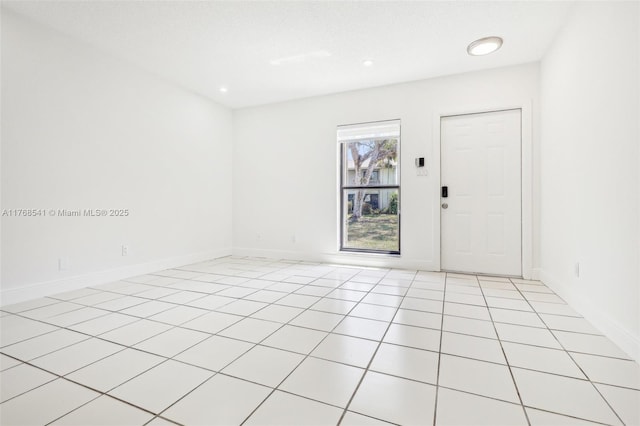 unfurnished room featuring light tile patterned flooring, baseboards, and recessed lighting