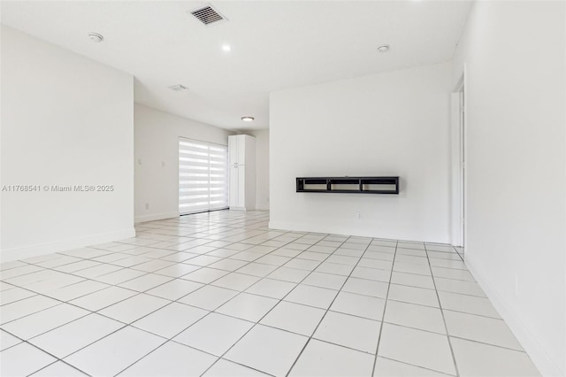 unfurnished living room with baseboards, visible vents, recessed lighting, and light tile patterned floors