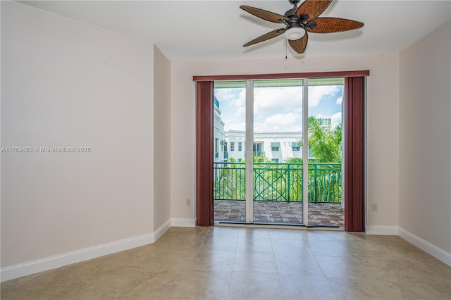 unfurnished room featuring baseboards and ceiling fan